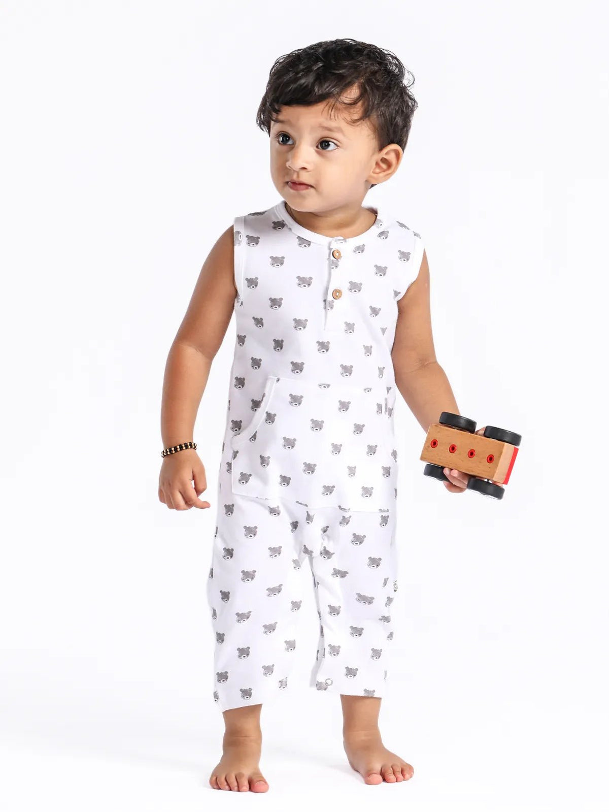 Sleeveless grey teddy pattern in white dungaree for baby