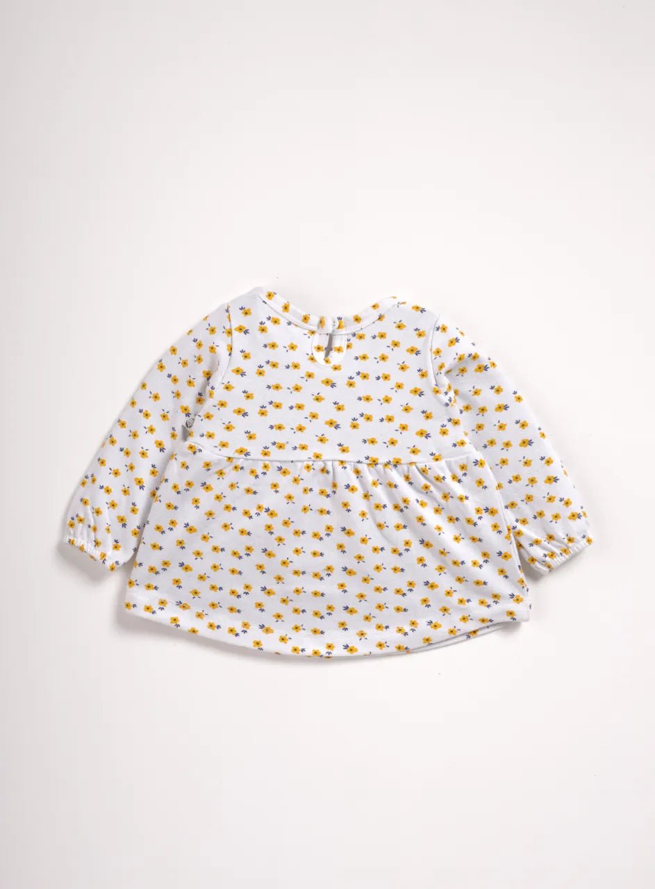 Full sleeve yellow flower pattern in white frock for baby girls