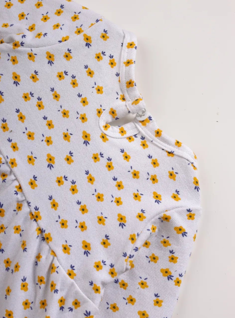 Full sleeve yellow flower pattern in white frock for baby girls